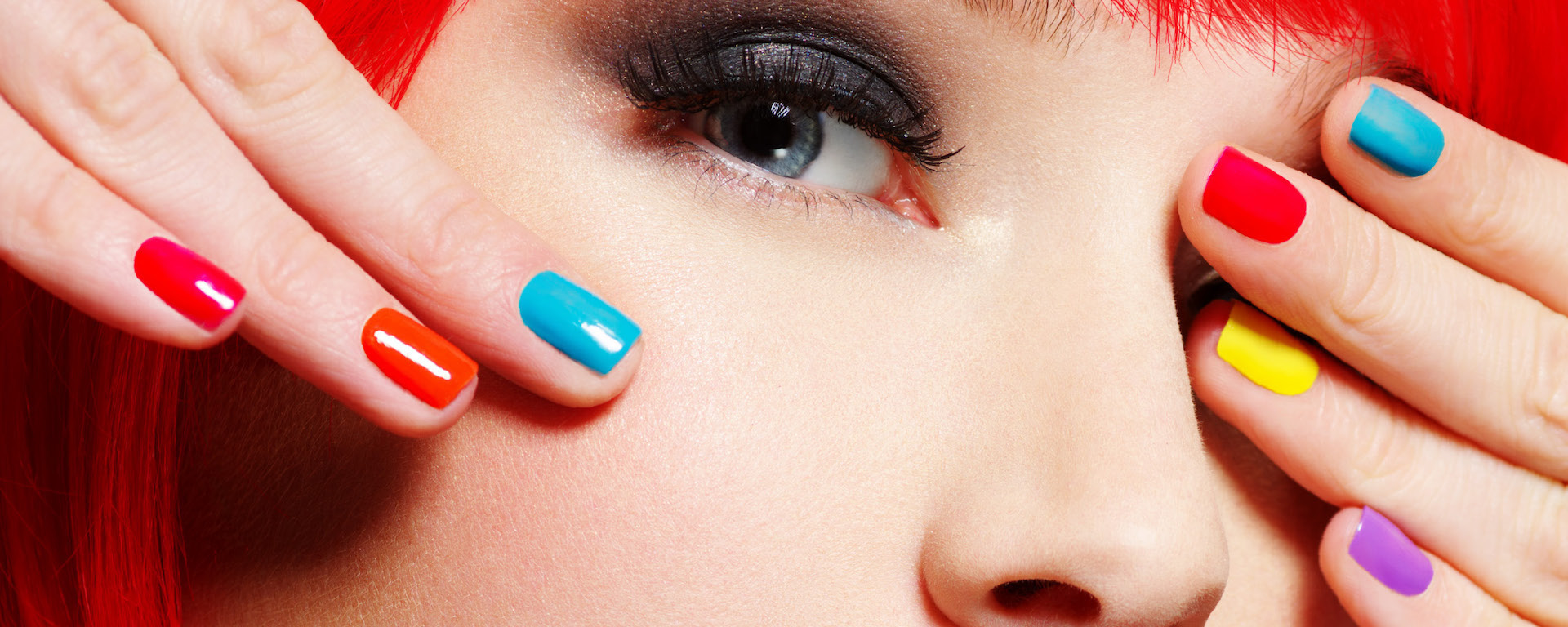 closeup-face-beautiful model with color nails