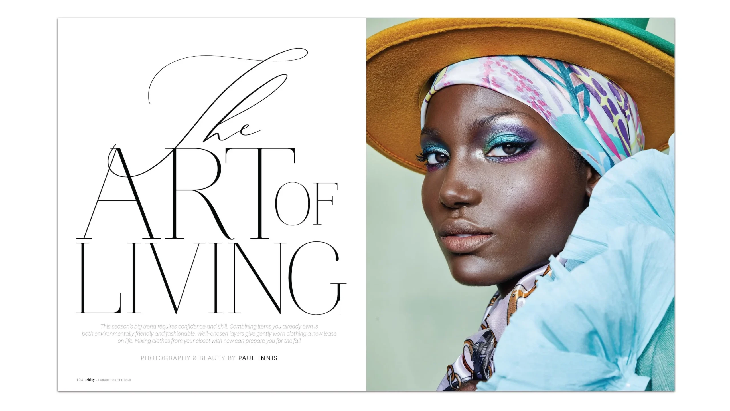 Ebby Magazine’s Art of Living fashion editorial featuring a stylish woman in a vibrant hat and scarf, embodying soulful elegance and lifestyle inspiration.