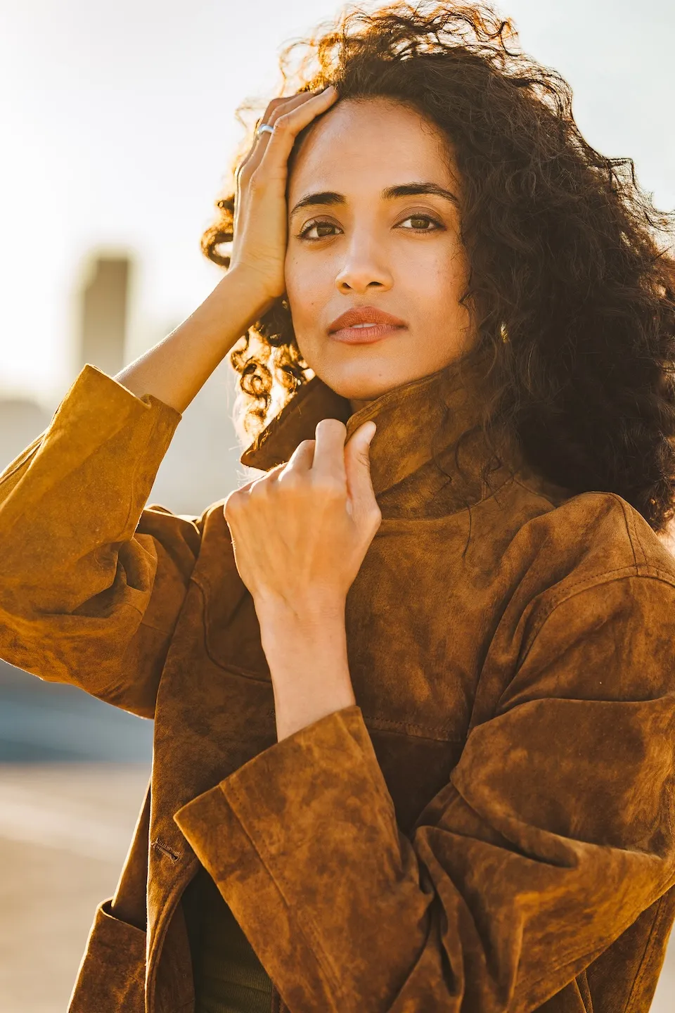 Alexandra Metz The Pitt actress portrait natural curls warm sunlight looking off camera