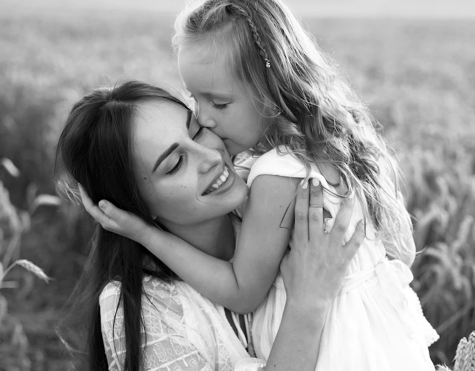mother and daughter embracing black and white luxury mother’s day gifts