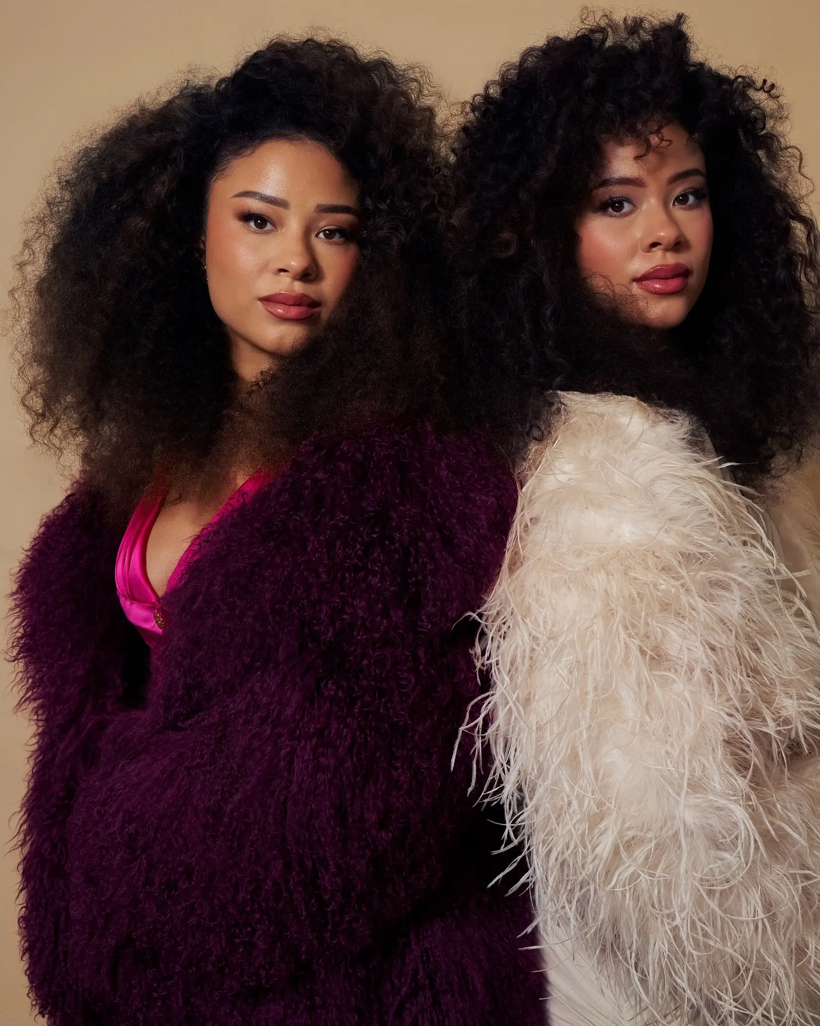 Lexie and Ana Lehrmann twins close-up portrait in luxury fashion with textured plum and ivory styling for Ebby Magazine