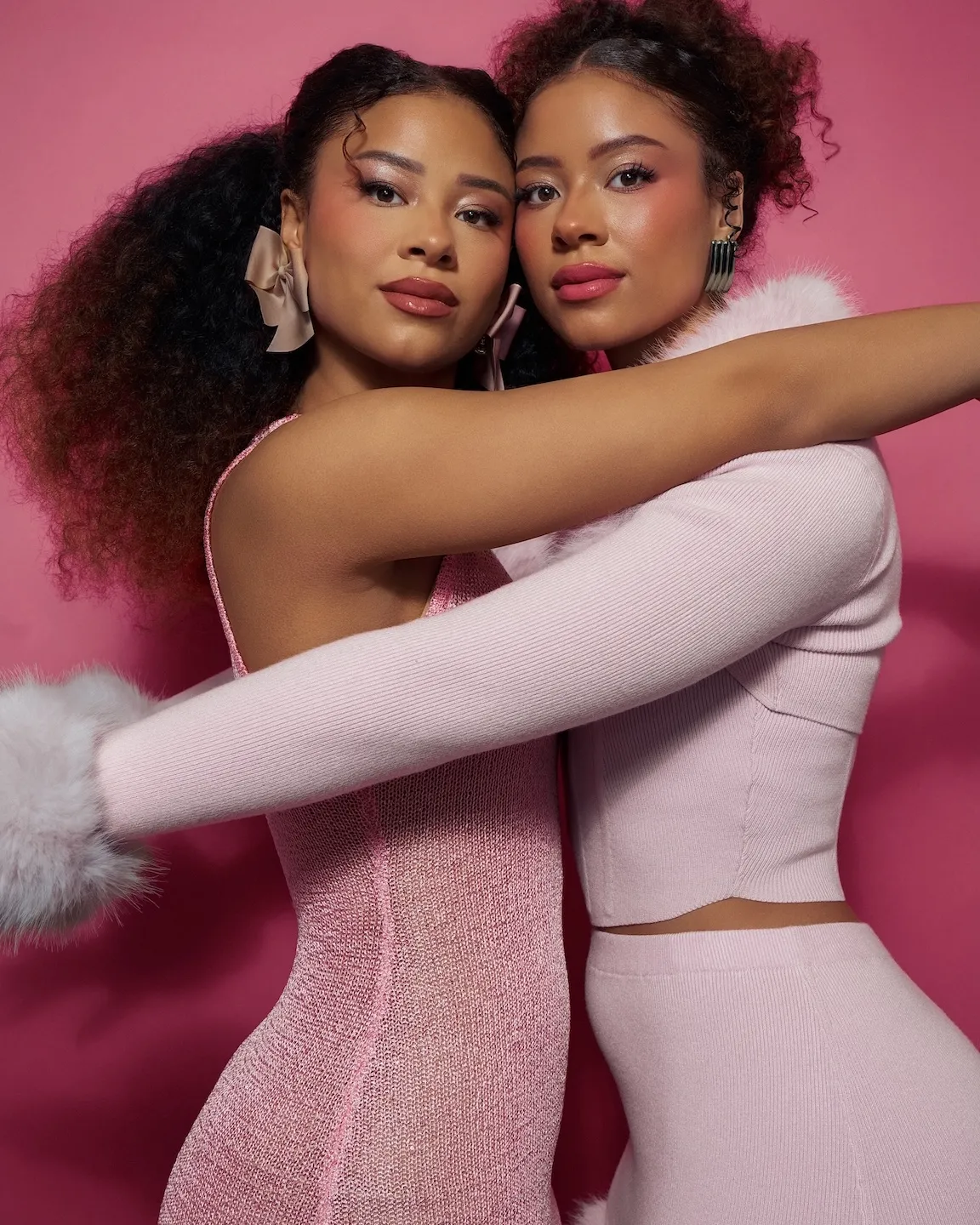 Lexie and Ana Lehrmann twins embracing in soft pink fashion portrait for Ebby Magazine