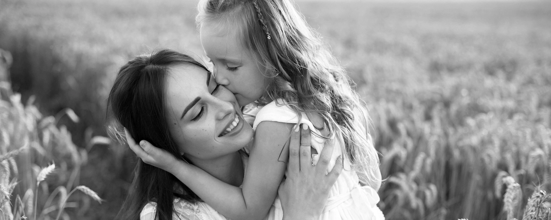 mother and daughter embracing in black and white for Mother’s Day