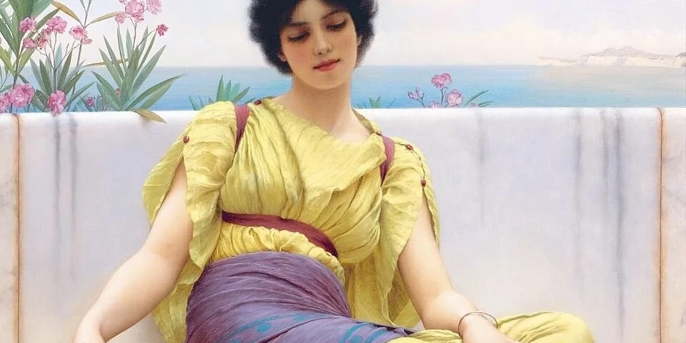 August 2026 horoscopes artwork featuring Idleness (1900) by John William Godward depicting a contemplative woman beside a tranquil sea.
